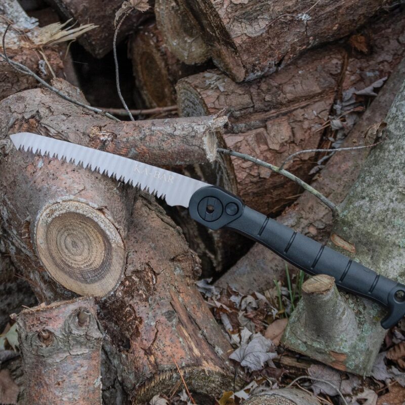 Ka-bar Folding Saw Ka-bar Folding Saw propped against cut logs