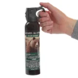 Guard Alaska Bear Spray - being held to show size